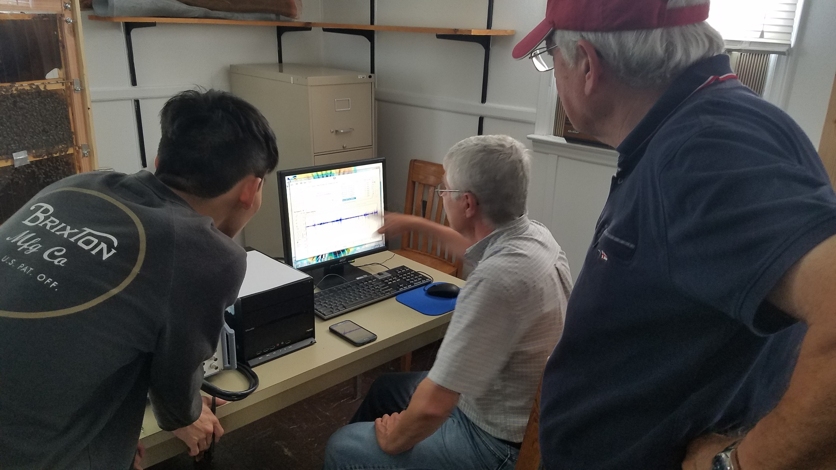 Tianyu, Ricardo and my dad inspecting the recording from one microphone.